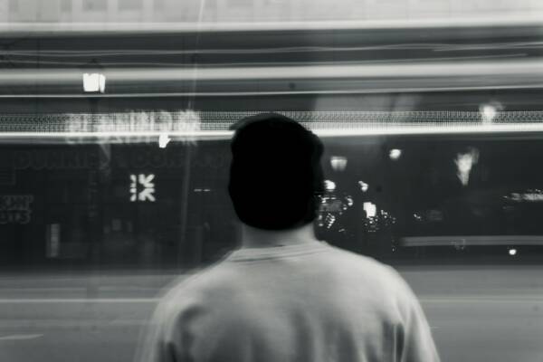a man standing in front of a store window